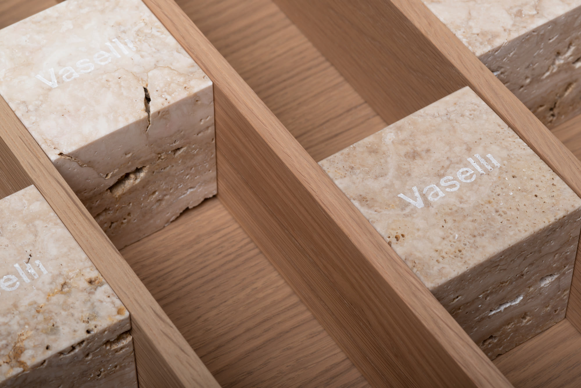 Vaselli — branded travertine blocks set into an oak drawer insert